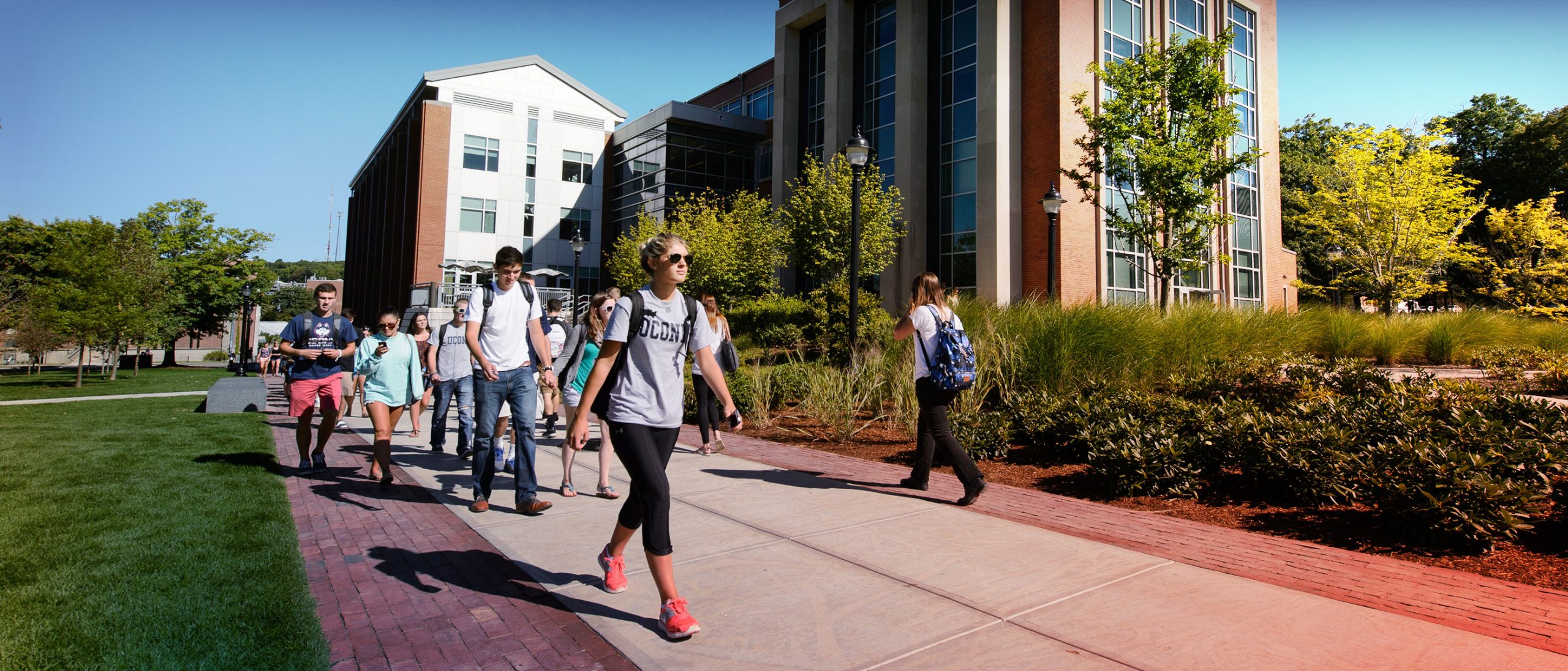 Students walk pass the Gentry building at UConn Storrs campus