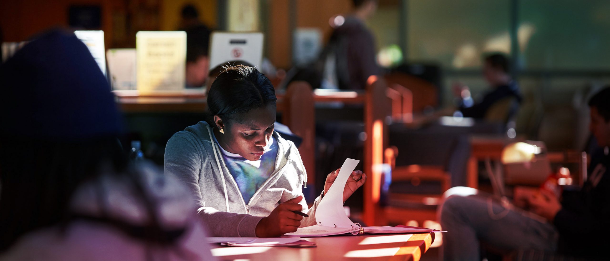 UConn student studies in the morning light