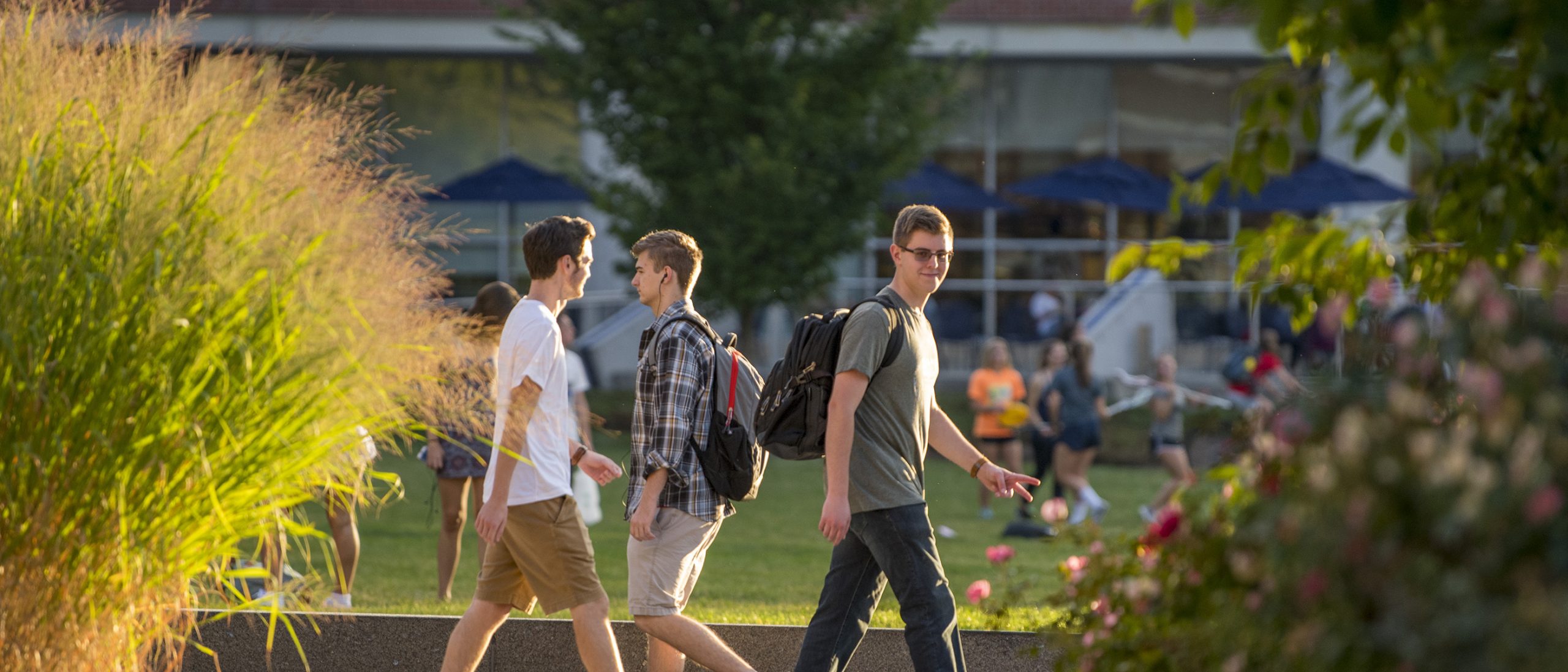Student walking near the Student Union Mall