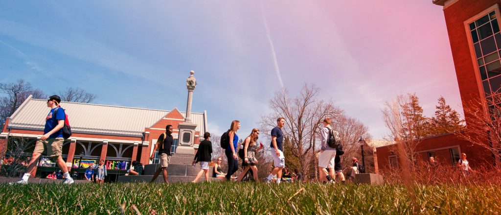 students walk by the Beanery, a cafe and art exhibit on the UConn Storrs campus