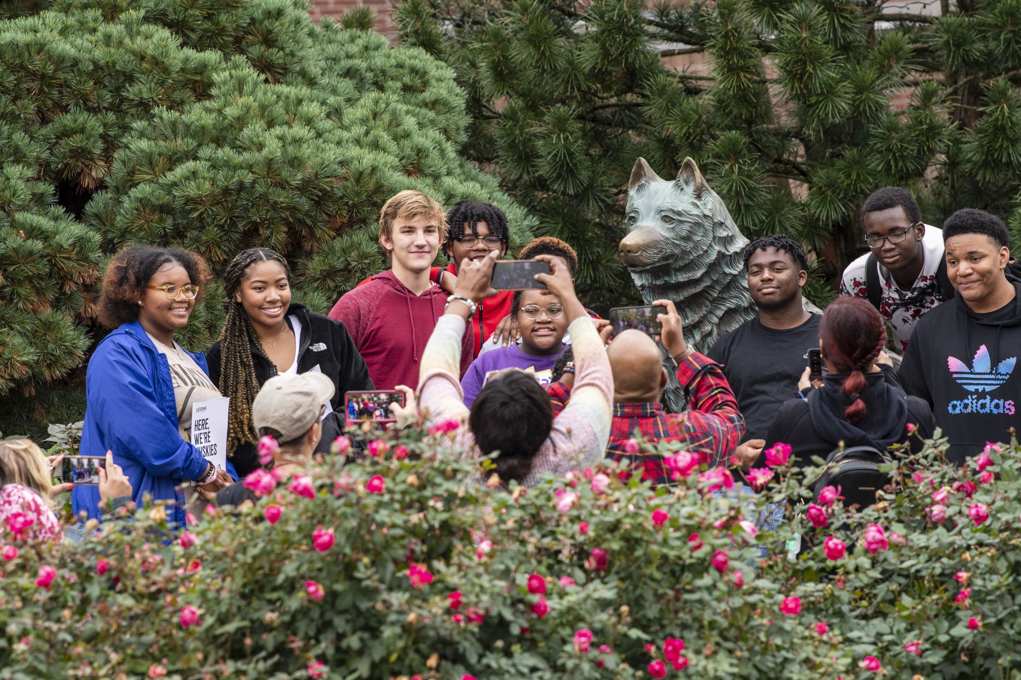 Taking a group photo in front of the Jonathan Statue.