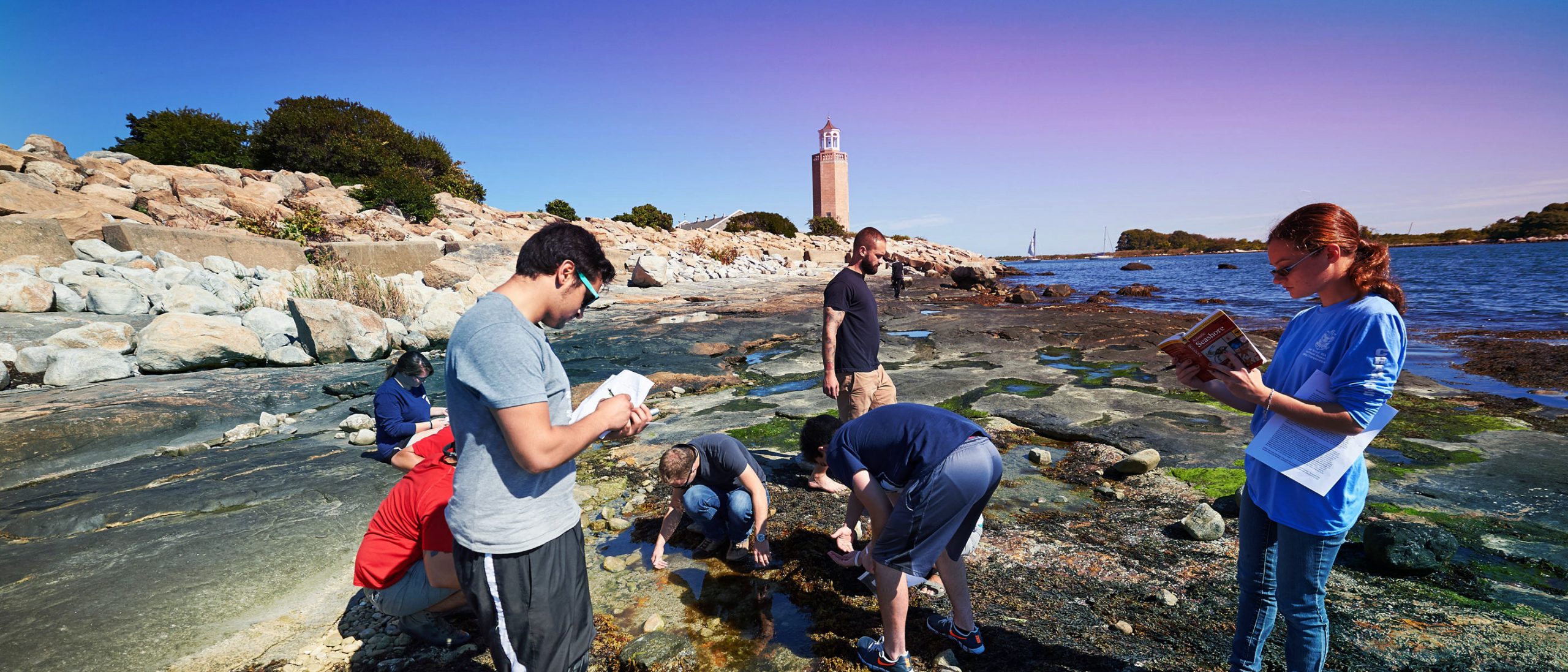 students research on the shoreline right on Avery Point campus