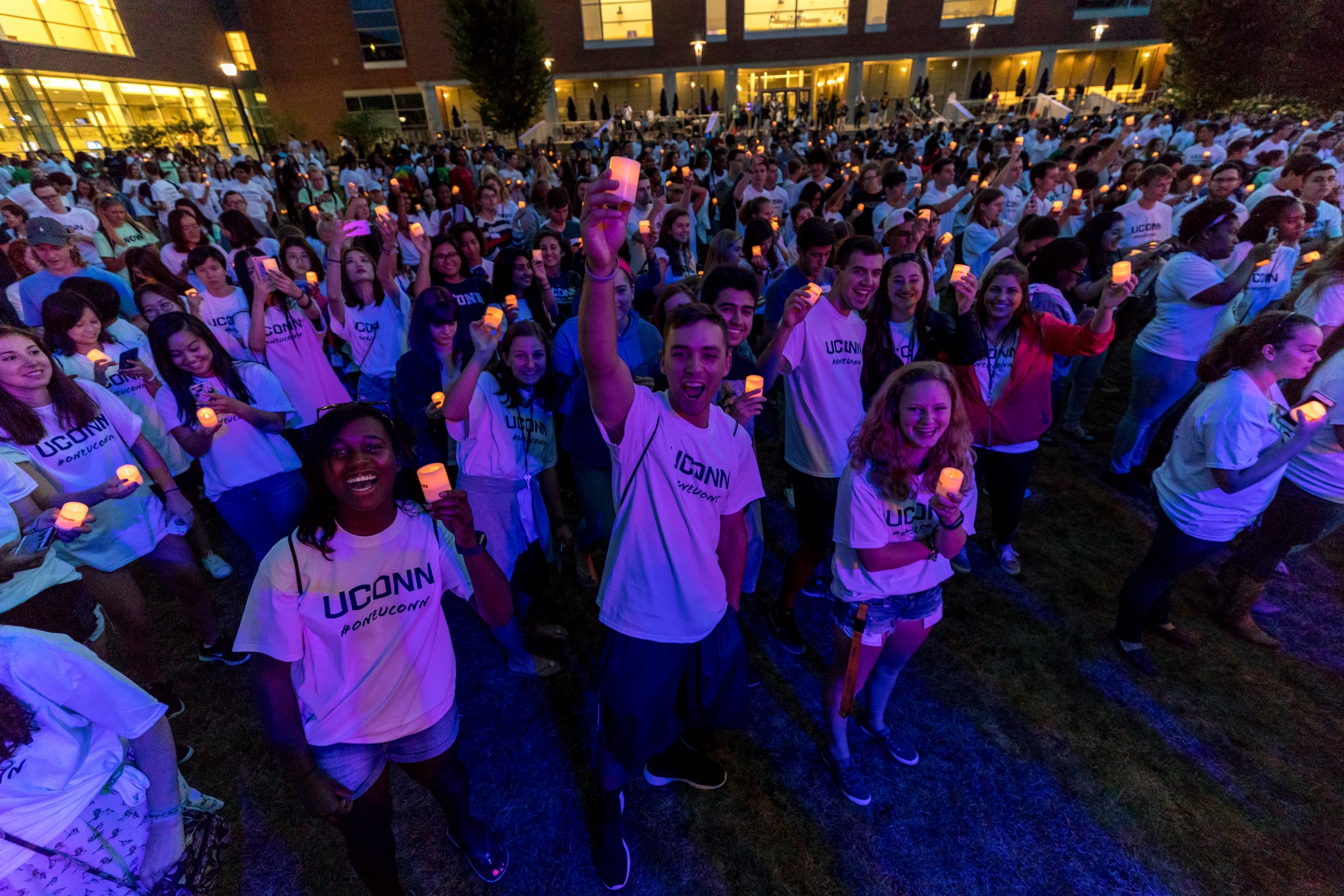 first year students holding up electronic candles